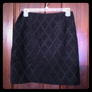 Petite Sophisticate black mini skirt.